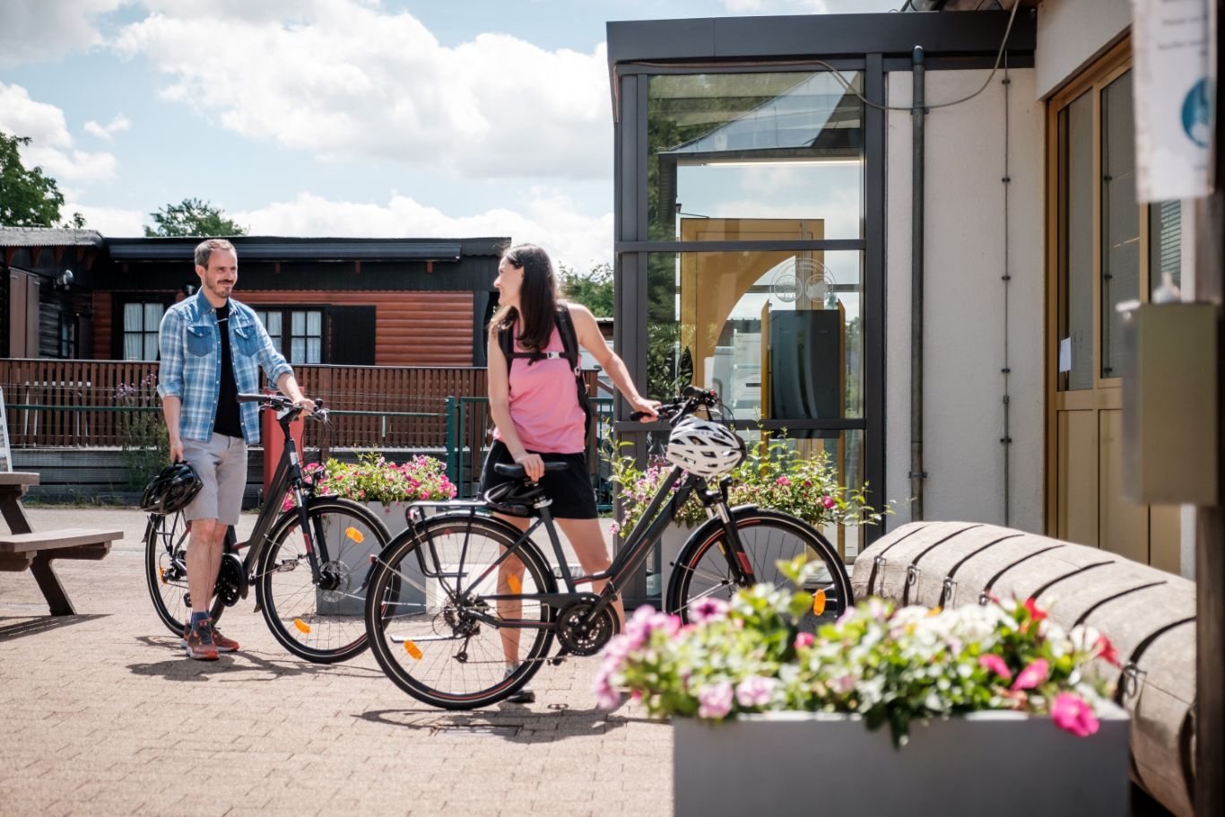 Two cyclist park their bikes in front of the Tourist Office in Beaufort