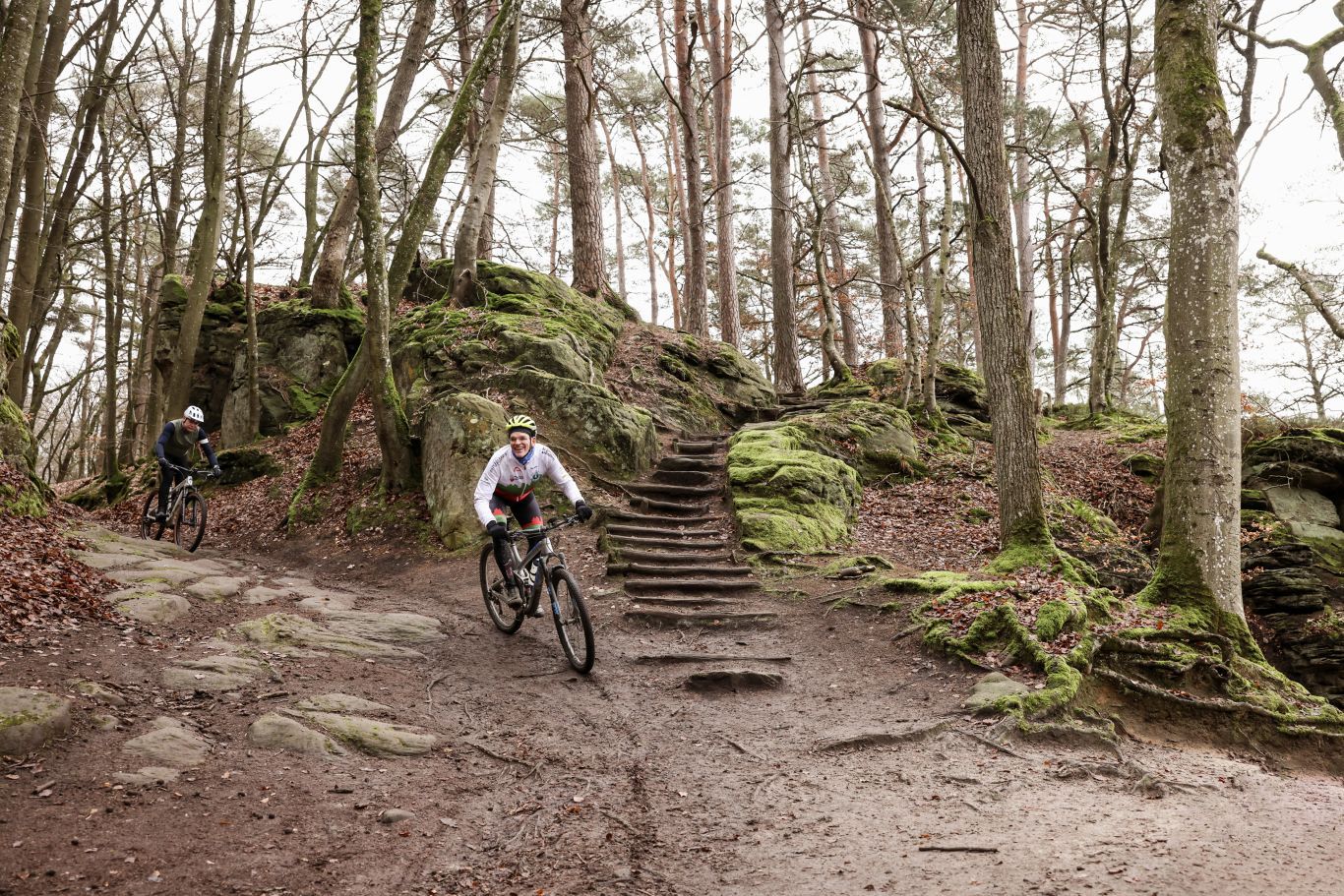 Mountain biking through the rocky forests of the Mullerthal Region