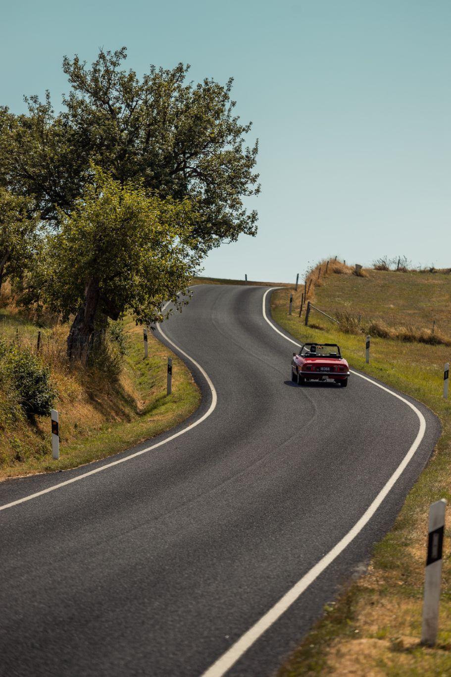 Touring car on a road in the Mullerthal Region
