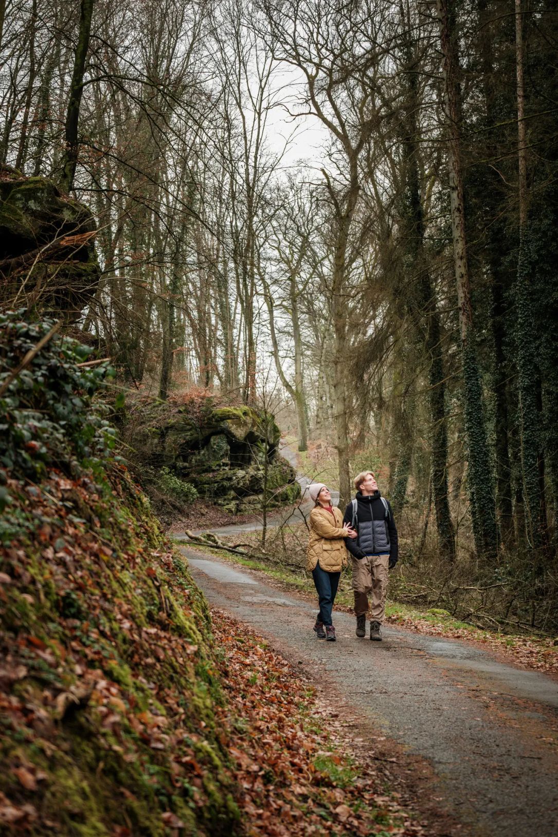 Hikers on the Mullerthal Trail Route 2 in Scheidgen near the "Härgottskapp"
